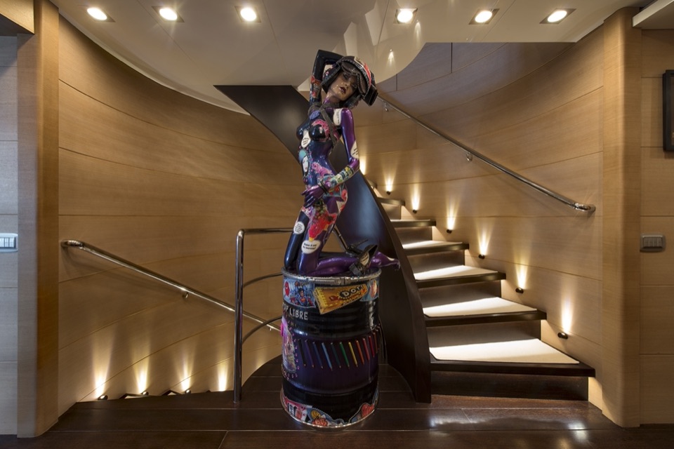 Lit staircase with a painted sculpture on board M/Y My Dream
