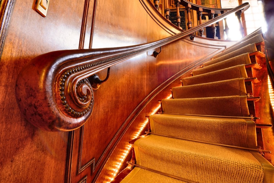 Carved wooden staircase on board M/Y Nero